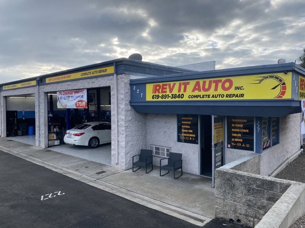 Rev It Auto Repair storefront at 227 N. Marshall Ave, El Cajon — yellow Rev It Auto sign over service bays